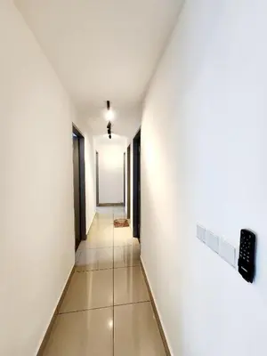 an empty hallway with white walls and tile floors at Cheras MRT KLCC View Home by DefineSuite in Kuala Lumpur