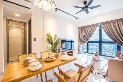 a dining room and living room with a table and chairs at Agile Bukit Bintang by Feel Home in Kuala Lumpur