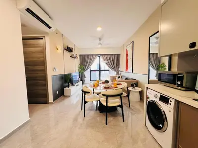 a kitchen and living room with a table and chairs at Agile Bukit Bintang by DeUrban in Kuala Lumpur