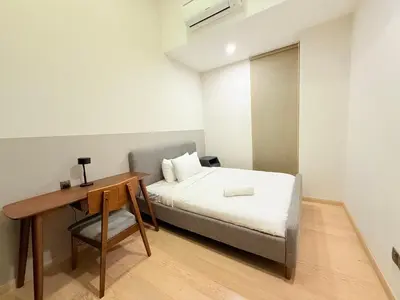 a small bedroom with a bed and a desk at Star Residence KL in Kuala Lumpur