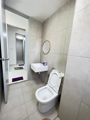 a bathroom with a toilet and a sink and a mirror at Cozy Kenwingston Platz KL 2-5 Pax2BR & 2BR FrePakin Netflix 3803 in Kuala Lumpur