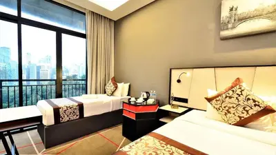 a hotel room with two beds and a large window at M101 Sky Suites at Dang Wangi KLCC in Kuala Lumpur