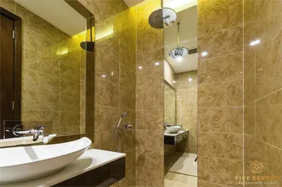 a bathroom with a sink and a shower at Dorsett Kuala Lumpur, Five Senses in Kuala Lumpur