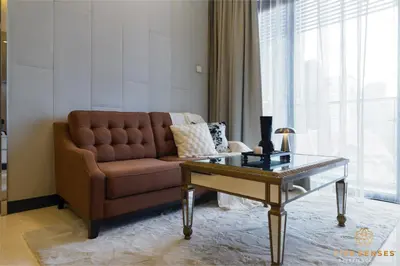 a living room with a couch and a coffee table at Dorsett Kuala Lumpur, Five Senses in Kuala Lumpur