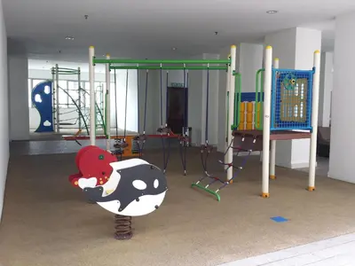 a play room with a playground with a cow on a pole at BEST KL City View at Regalia Residence in Kuala Lumpur