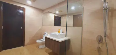 a bathroom with a toilet and a sink and a shower at BEST KL City View at Regalia Residence in Kuala Lumpur