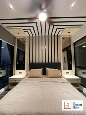 a large white bed in a room with windows at KLCC Scarletz Executive Suite by ThePigeonHole in Kuala Lumpur