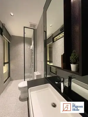 a bathroom with a sink and a toilet and a mirror at KLCC Scarletz Executive Suite by ThePigeonHole in Kuala Lumpur