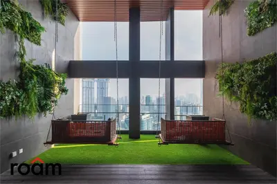 a room with two chairs and a large window at The Riv, Riveria City KL Sentral in Kuala Lumpur