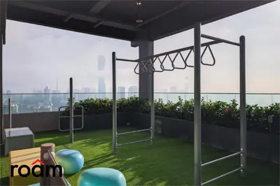 a balcony with a swing set on a roof at The Riv, Riveria City KL Sentral in Kuala Lumpur