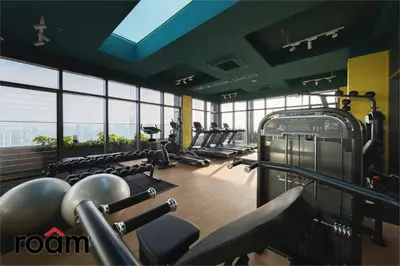 a gym with a row of treadmills and machines at The Riv, Riveria City KL Sentral in Kuala Lumpur