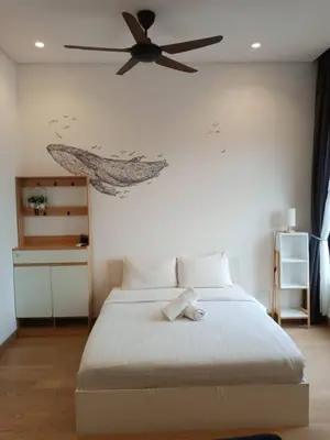 a bedroom with a bed with a ceiling fan at TS Hotel Service Residence Kuala Lumpur in Kuala Lumpur