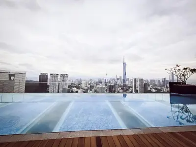 a swimming pool with a view of a city at Riveria City by Nomadnest in Kuala Lumpur