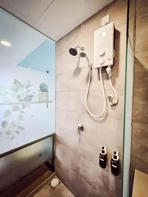 a bathroom with a shower with a shower head at Riveria City by Nomadnest in Kuala Lumpur