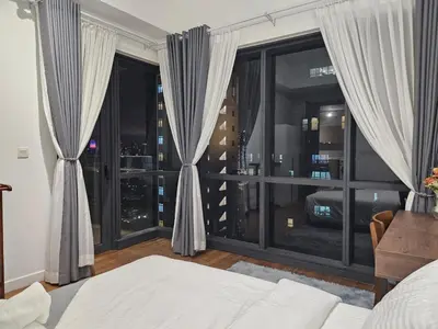 a bedroom with a bed and a large window at Cemara Premier Residence Ampang Near KLCC Kuala Lumpur in Kuala Lumpur