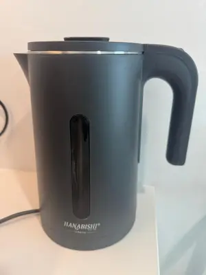 a black pot sitting on top of a counter at Alfa Bangsar By Nova Host in Kuala Lumpur