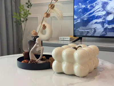 a couple of figurines sitting on top of a table at Alfa Bangsar By Nova Host in Kuala Lumpur