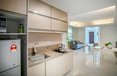 a kitchen with a sink and a refrigerator at Carlton, Chelsea at Plaza Damas 3, Sri Hartamas Kuala Lumpur in Kuala Lumpur