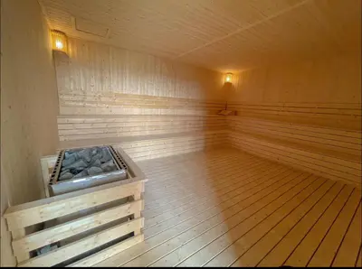 a large empty sauna with a wooden floor and wooden floors at New Luxury 2bed 2bath apartment in Kuala Lumpur