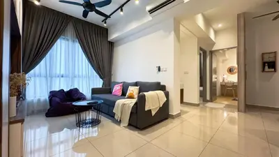 a living room with a couch and a table at M Centura Sentul Kuala Lumpur, Fully Air-Con 2-Bedroom Home in Kuala Lumpur