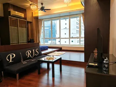 a living room with a couch and a table at Parkview Serviced Apartment in Kuala Lumpur