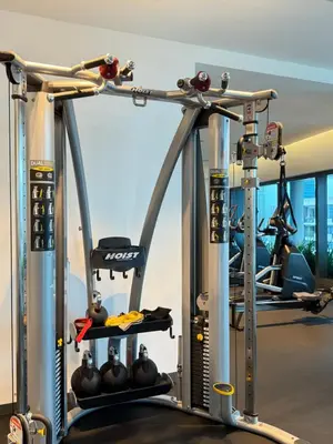a gym with two treadmills and weights at Eaton KLCC Infinity Pool by NP in Kuala Lumpur