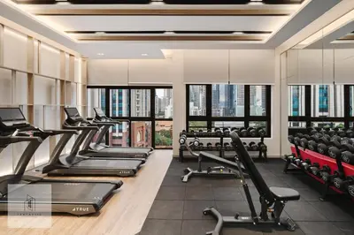 a gym with cardio machines and treadmills at Agile Bukit Bintang by Fantastic Home in Kuala Lumpur