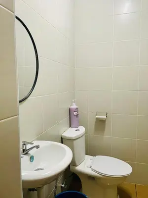 a bathroom with a toilet and a sink at Homestay Kuala Lumpur in Kuala Lumpur