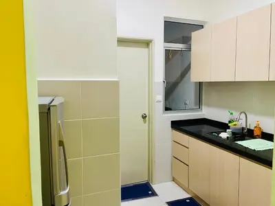 a kitchen with a sink and a refrigerator at Homestay Kuala Lumpur in Kuala Lumpur