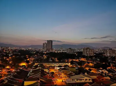 a view of a city at night with buildings at Homestay Kuala Lumpur in Kuala Lumpur