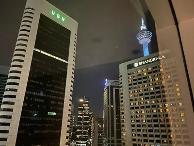 a view of a city at night with the space needle at Vortex Suites KL33 in Kuala Lumpur
