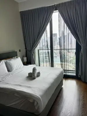 a bedroom with a bed with a large window at OPUS LUXURY INFINiTY POOL KL in Kuala Lumpur