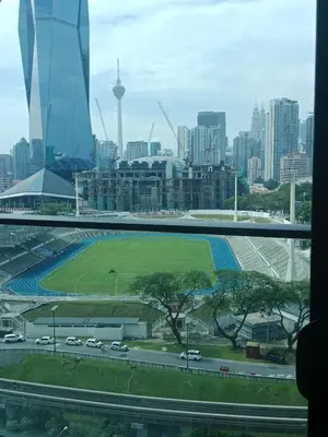a view of a city with a soccer field at MAXX ROYEL AT OPUS RESiDENCE in Kuala Lumpur