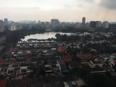 an aerial view of a city with a river and buildings at M CITY 2 Bed KLCC BY D in Kuala Lumpur