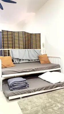 two bunk beds in a room with a wall at The Home by Fidi at Continew Residence in Kuala Lumpur