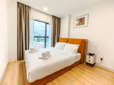 a bedroom with a bed with two hats on it at The Atrium at Jalan Ampang by OKBnB - 3Bedroom Apartment with FREE WiFi & Carpark in Kuala Lumpur