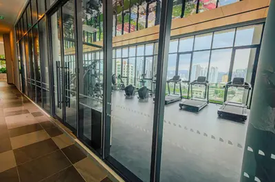 a gym with a bunch of treadmills in a building at The Atrium at Jalan Ampang by OKBnB - Cozy 2 Bedroom, 3 mins to KLCC in Kuala Lumpur