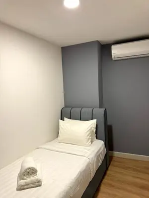 a bedroom with a bed with a pillow on it at The Atrium at Jalan Ampang by OKBnB - Cozy 2 Bedroom, 3 mins to KLCC in Kuala Lumpur