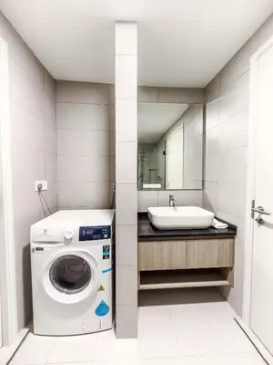 a bathroom with a washing machine and a sink at The Atrium at Jalan Ampang by OKBnB - Cozy 2 Bedroom, 3 mins to KLCC in Kuala Lumpur