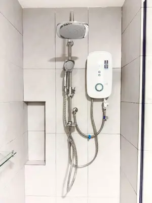 a shower with a shower head in a bathroom at The Atrium at Jalan Ampang by OKBnB - Beautiful 2Bedroom nearby KLCC in Kuala Lumpur