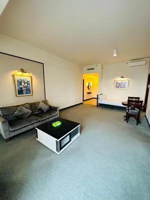 a living room with a couch and a table at KL Cozy Suite Apartment At Times Square in Kuala Lumpur