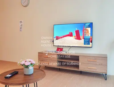 a living room with a flat screen tv on a wall at KL Midvalley LRT Bangsar Modern BTC12 D in Kuala Lumpur