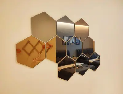 a mirror hanging on a wall in a room at KL Midvalley LRT Bangsar Modern BTC12 D in Kuala Lumpur