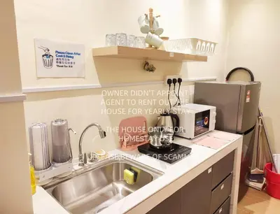 a kitchen with a sink and a counter top at KL Midvalley LRT Bangsar Modern BTC12 D in Kuala Lumpur