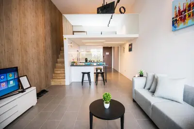 a living room with a couch and a table at Bangsar Signature By PSM in Kuala Lumpur