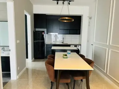 a kitchen with a table and chairs in a room at Axon Residence Bukit Bintang Pavilion KL in Kuala Lumpur