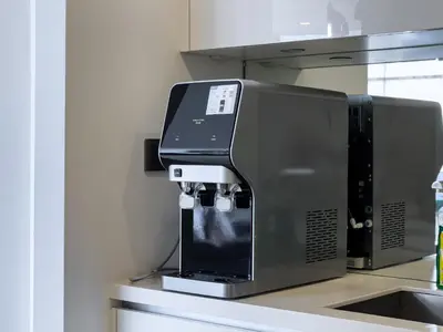 a coffee machine sitting on top of a kitchen counter at Vortex Suites klcc By Sky House in Kuala Lumpur