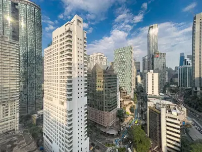 an aerial view of a city with tall buildings at Vortex Suites klcc By Sky House in Kuala Lumpur