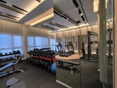 a gym with lots of treadmills and exercise equipment at Agile Service Suites Bukit Bintang By TRX in Kuala Lumpur