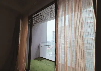 an open window with a view of a building at The Element Condo 3BR with KL Skyscraper View in Kuala Lumpur